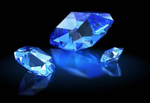 Sapphire, the blue crystalline variety of corundum ($Al_2O_3$), stands as the bedrock of the colored gemstone investment sector. While emeralds are defined by their fragility and inclusions, sapphire offers a structural resilience—rated at 9 on the Mohs scale—that makes it the premier choice for assets intended to survive multi-generational wealth transitions. Our analysis moves beyond the subjective "blue" labels and into the quantum-mechanical properties that dictate market-leading prices.